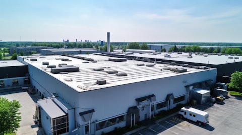 An aerial view of a large industrial roofing system installed by the specialty chemical company.