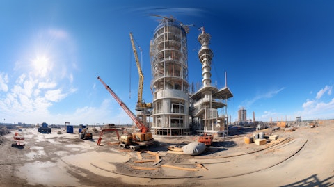 A 360 degree view of a partially constructed tower, featuring various pieces of equipment and constructionmaterials.