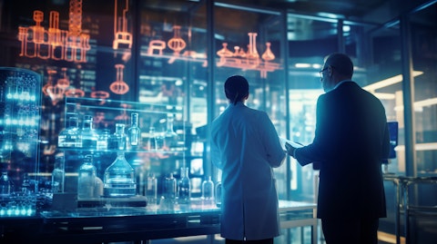 A biopharmaceutical executive discussing plans with a government laboratory.