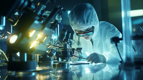 A scientist working on a complex photonics instruments in a sterile laboratory setting.