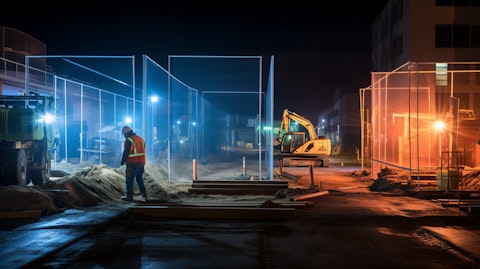 A construction site at night with long exposure illuminating specialty materials and trench shields.