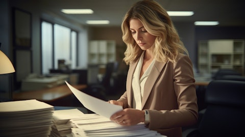 An accountant meticulously going over documents in her office, exemplifying the company's commitment to accuracy and detail.