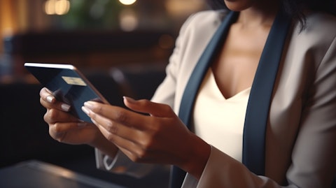A businesswoman using a digital tablet, making a payment using the company's payment processing technology.