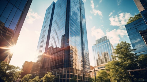 A wide-angle view of a high-rise office property with the REIT company's logo in the foreground.
