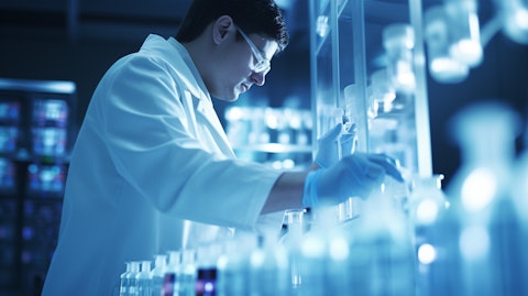 A scientist in a lab coat inspecting a vial of medication in an experimental biopharmaceutical laboratory.