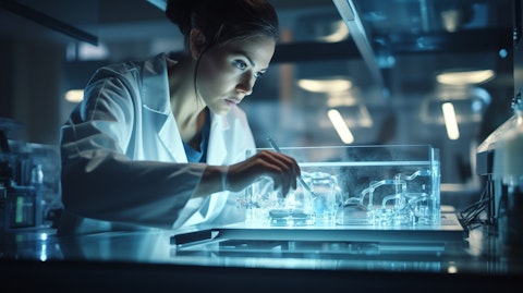 A biomedical scientist using the latest equipment to engineer a drug delivery technology.