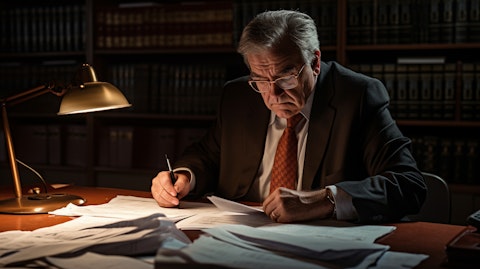 An experienced tax accountant reviewing paper work on their desk.
