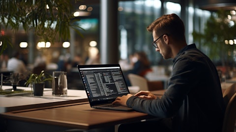 A software engineer debugging a compliance code on a laptop in a modern office setting.