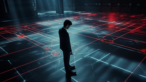 An employee using a laser projector to map out the floor plan of a large room.