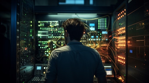 A telecom engineer behind the control board in a comms facility.