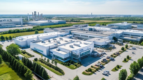 An aerial view of a biopharmaceutical manufacturing plant, signifying the company's expansive operations.