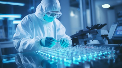 A scientist in a lab coat working with antiviral therapeutics at a biopharmaceutical company.