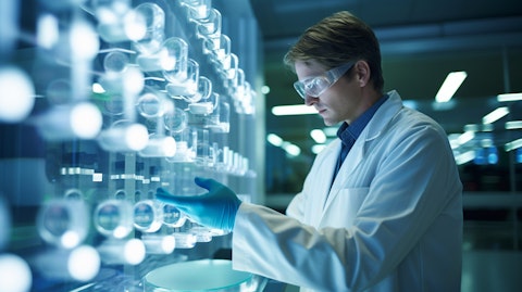 A researcher in a lab coat examining a petri dish of a biopharmaceutical drug.