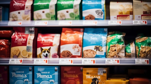 A close up of a grocery store shelf with packages of the company's pet food products on it.