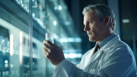 A close-up of a scientist in a lab coat inspecting a vial of therapeutic medicine.