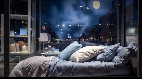 A close-up of a window display featuring Sleep Solutions bedding products.