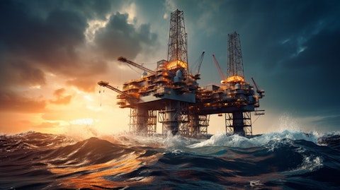 A close-up of an oil rig in motion with the ocean shining in the background.