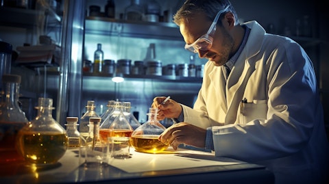 A chemical engineer studying a lab sample of a food product for safety regulations.