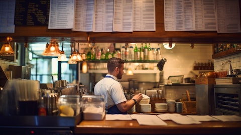 The front counter of the restaurant, with the menu illuminated in the background.