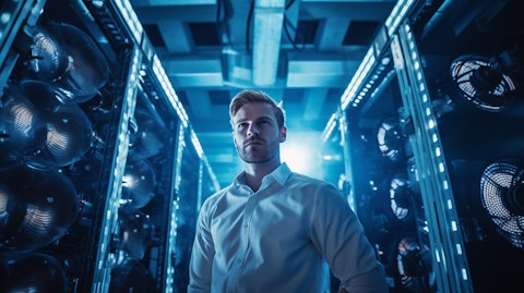 A technician surrounded by complex chillers and data center cooling solutions.