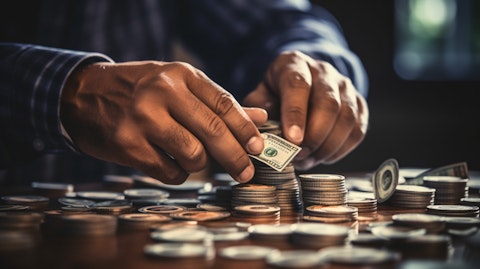 A close-up of a hand, counting the money from the subscription fees of the Entertainment Communication Services company.