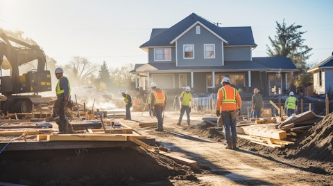 A construction team working in unison to build a single-family home in a neighborhood.