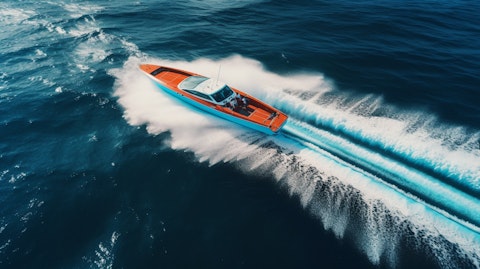 An aerial view of a performance sport boat slicing through the waves in perfect harmony.