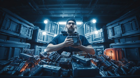 A research engineer surrounded by hardware, demonstrating the company's secure container offerings.