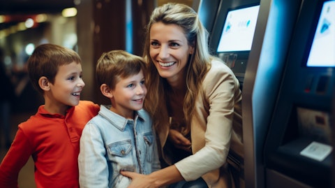 A smiling mother with her children accessing an ATM, demonstrating the company's easy banking services for customers.