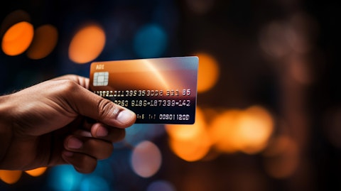 A close-up of a hand holding a credit card, representing the companies multi-level payment services.