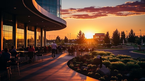 A picturesque sunset view of the Graton Resort & Casino, with patrons gambling in the background.
