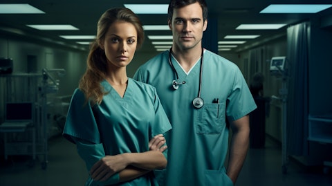 A nurse in uniform, with a patient, representing the commitment to nursing and allied staffing.