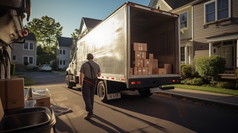 A truck driver unloading a shipment of consumer nondurables in a residential neighborhood.