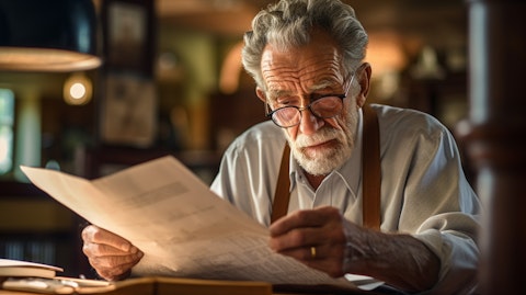 An old man wide-eyed, examining financial documents at his local bank.