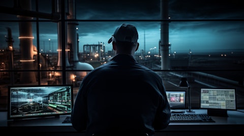 A technician in a control room monitoring energy flows from a natural gas-fired power plant.