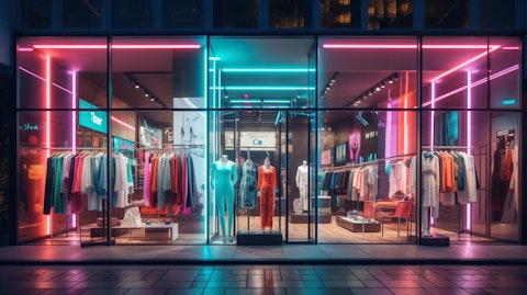 A modern fashion boutique lit up with neon display signs.