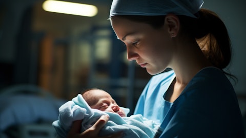 A neonatal nurse cradling a newborn in her arms, contentment on her face.