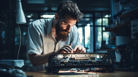 A computer engineer assembling a modern cordless keyboard in their laboratory.