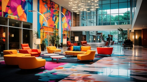 A hotel lobby in vibrant colors, reflecting the hospitality and global presence of the hotel franchising company.