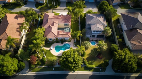 Aerial view of a residential property with visible building maintenance efforts.