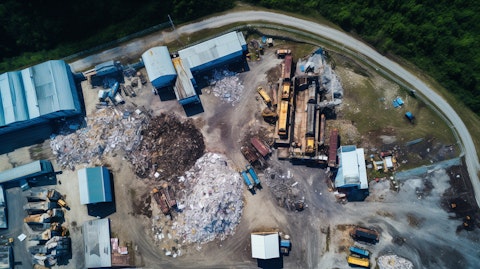 An aerial view of a plastic waste recycling plant, showcasing the company's efforts towards a cleaner environment.