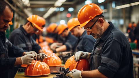 Workers assembling industrial head protection products on the production line.