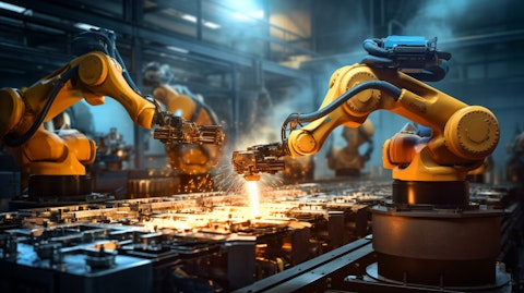 An industrial robotic arm automating the production of metal containers.