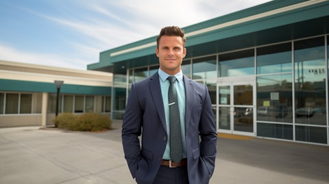 A real estate broker standing in front of an outpatient medical property.