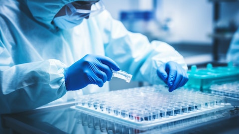 A biotechnologist working in a laboratory, examining the effects of a Janus Kinase type 1 inhibitor on plaque psoriasis.