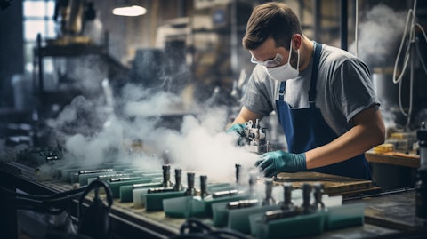A worker in a factory environment assembling a e-vapor product.