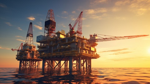 An oil platform in the sea, illuminated by a sunset, showing the companies power.