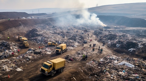 Aerial view of a landfill, with the waste management company's flagship vehicles toiling away.