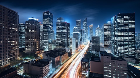 Long exposure of a busy city skyline featuring tall roof tops of different hotel brands.