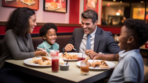 A family enjoying their meal at a restaurant from the company's franchise operations.